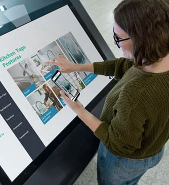 women using interactive screen